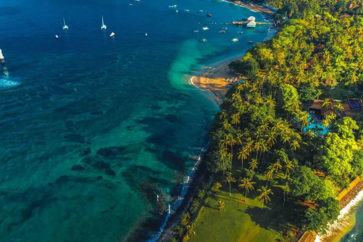 Tropical beach with a sandy shore and blue water