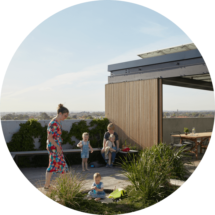 Nightingale building rooftop with family playing