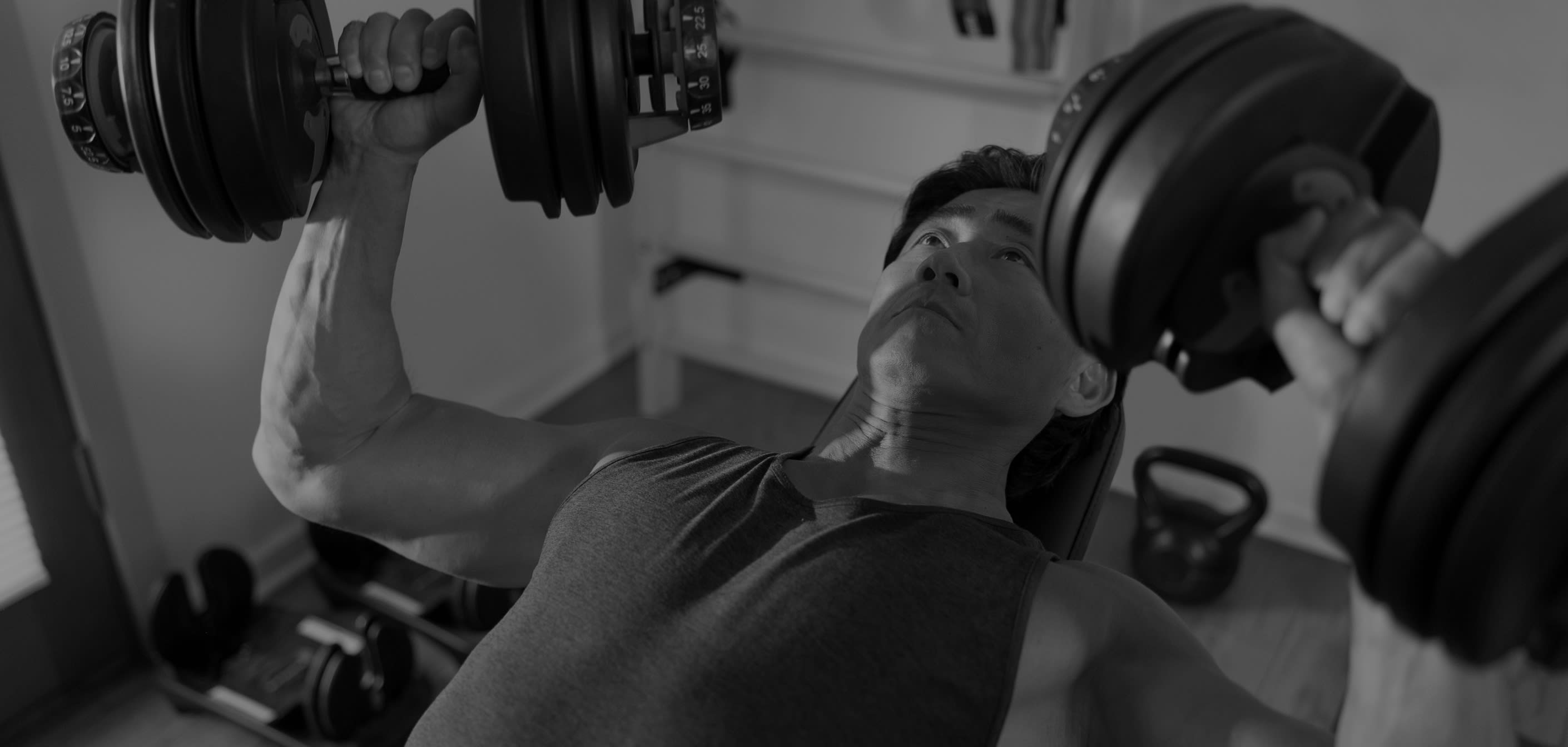 Man lifting weights in a gym