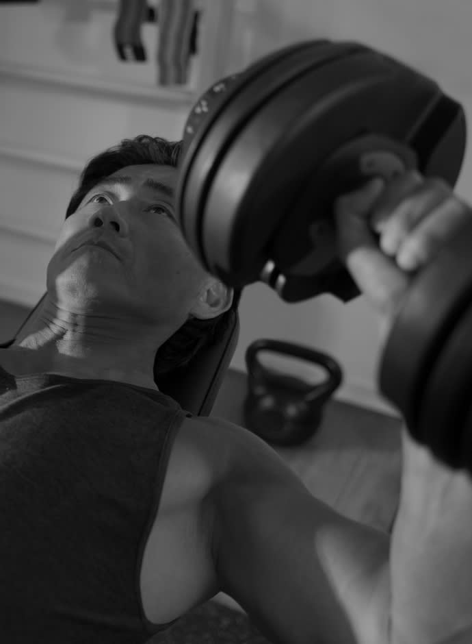 Man lifting weights in a gym