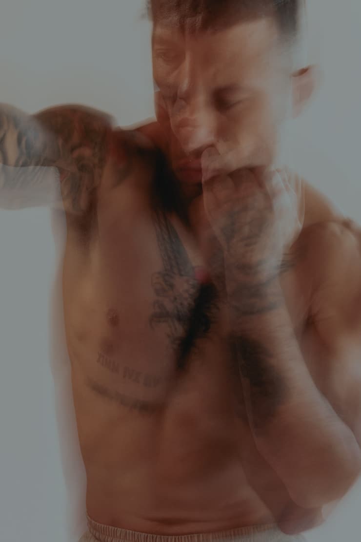 Man practicing boxing with focused intensity