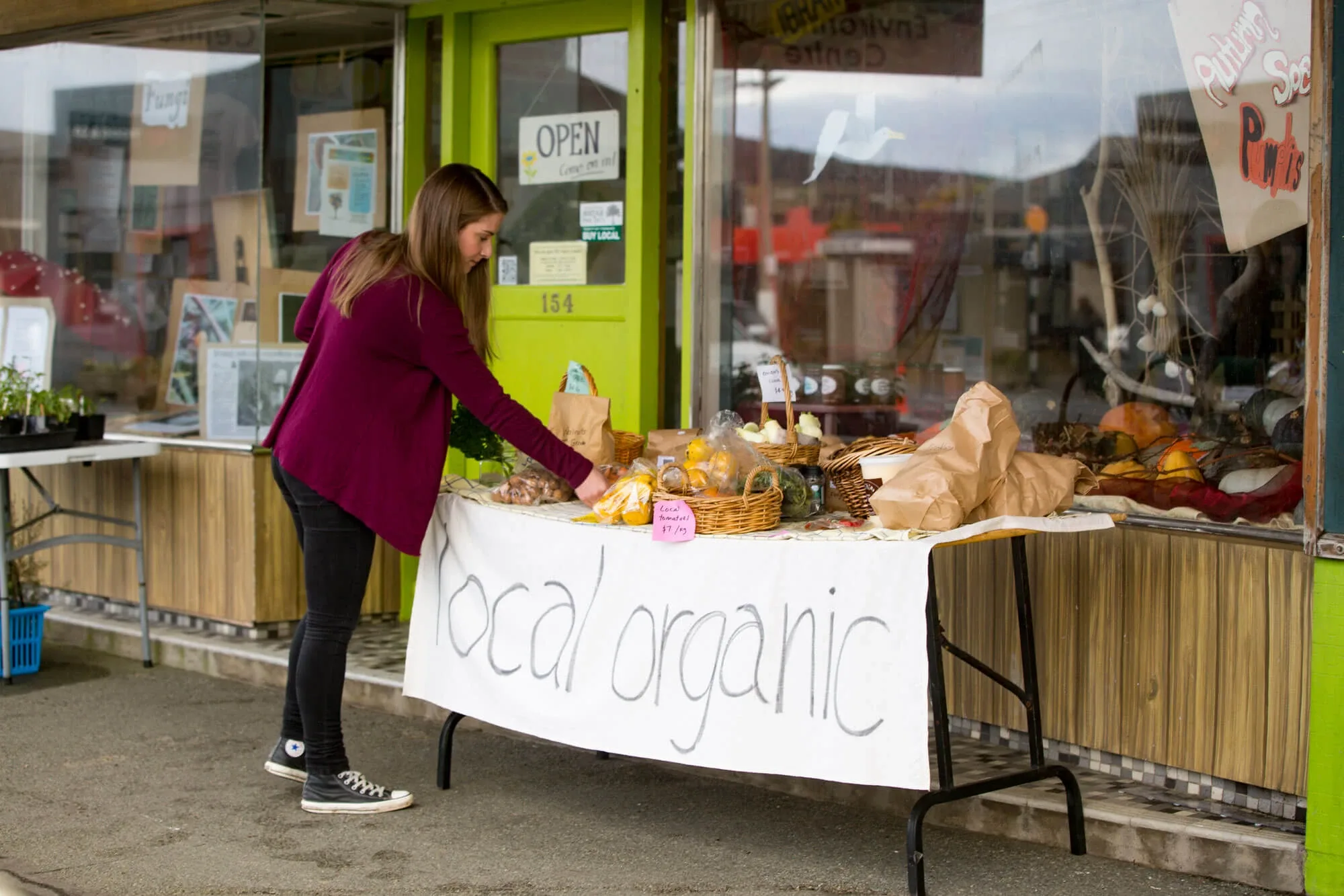 girl looking at the local organic produce
