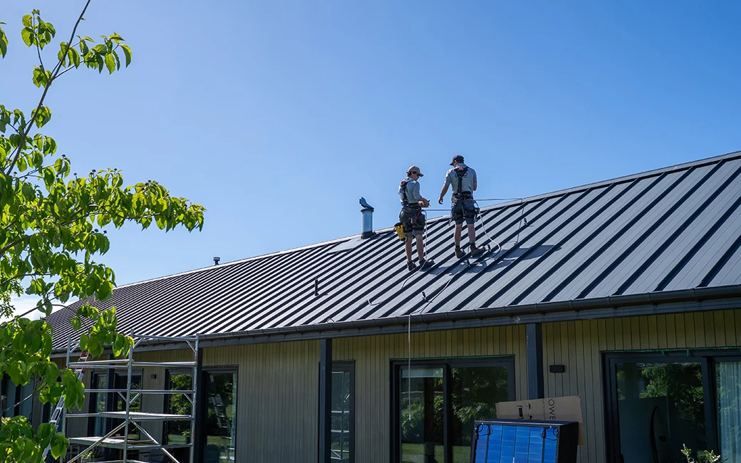 Aotea Electricians on the roof of a house