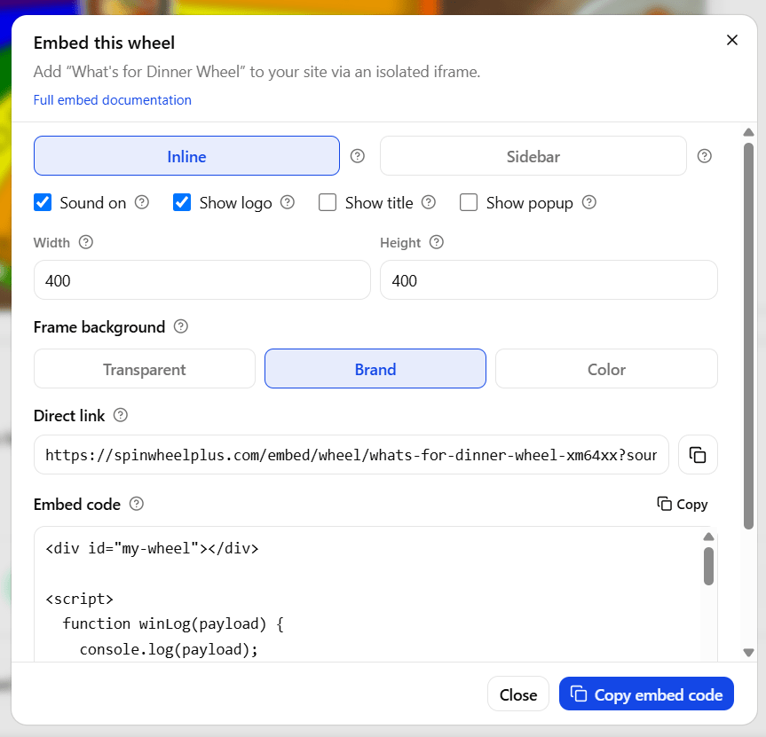 SpinWheelPlus Embed dialog showing Inline and Sidebar options with a live wheel preview and Copy embed code button
