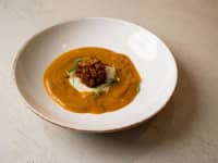 Spiced sweet potato soup topped with a crisp bhaji unwaws