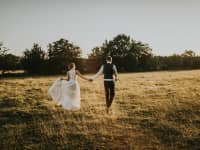 Tythe Barn Wedding Couple Walking in Field