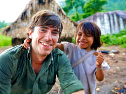 Simon Reeve with village child