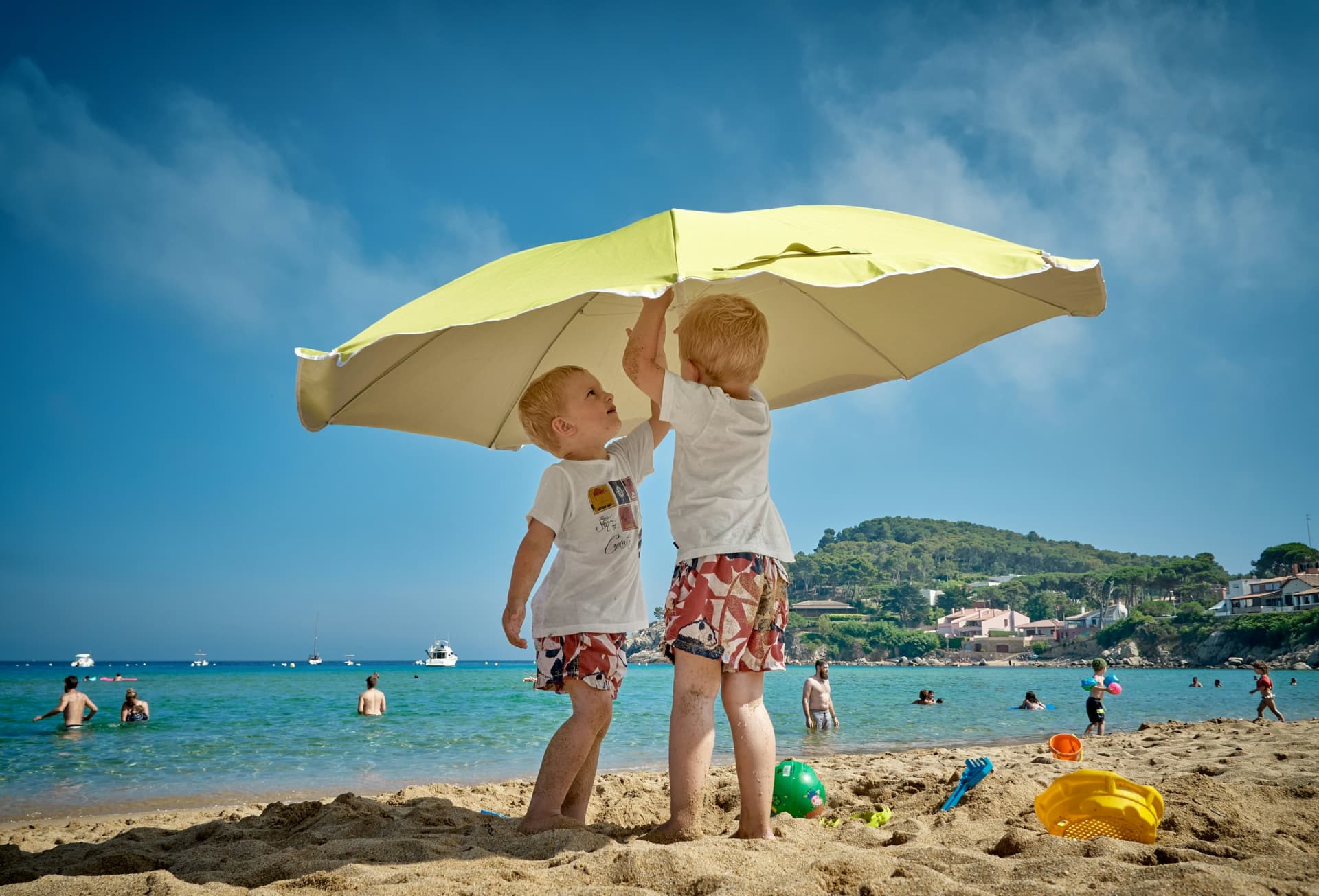 Kids under a parasol
