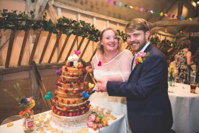 Real Wedding Chris Rachel cutting the cake