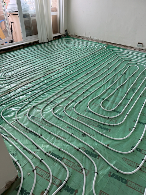 Underfloor heating pipework loops before the screed is laid