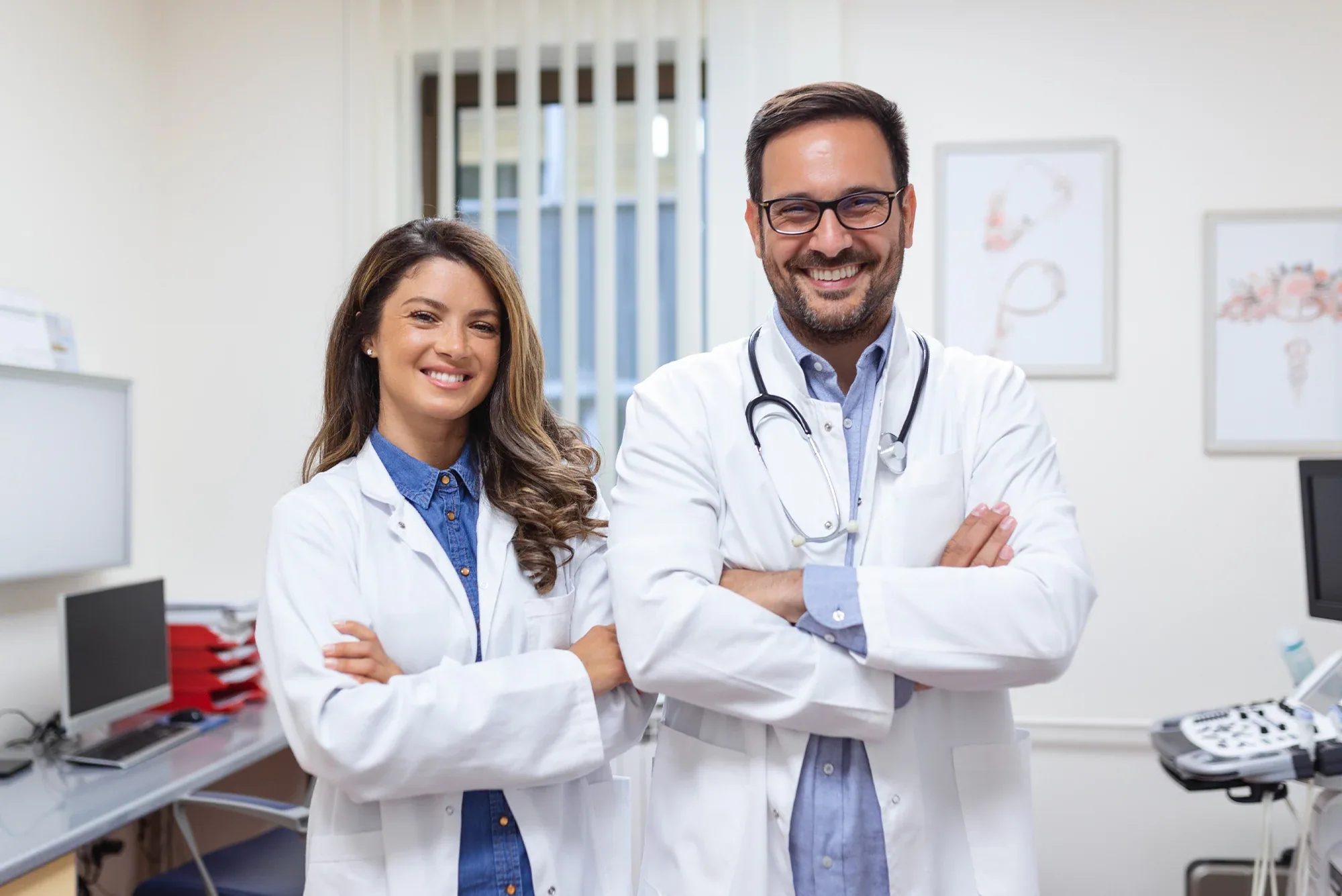 Two physicians standing together in a clinic