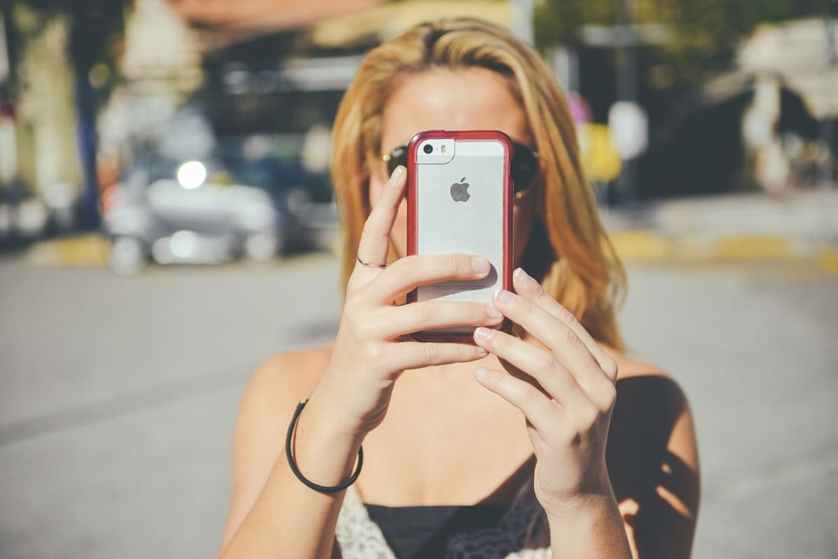 Woman sending money phone