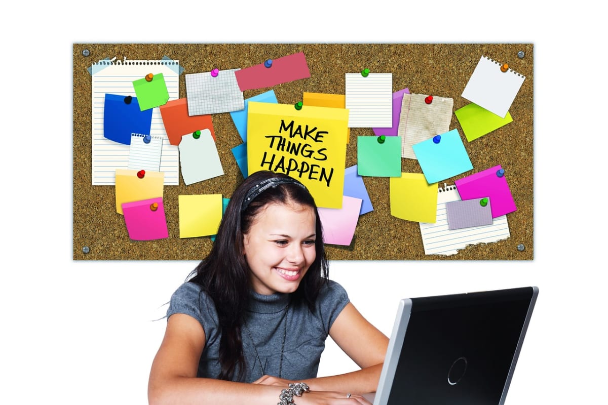 Woman laptop notes desk