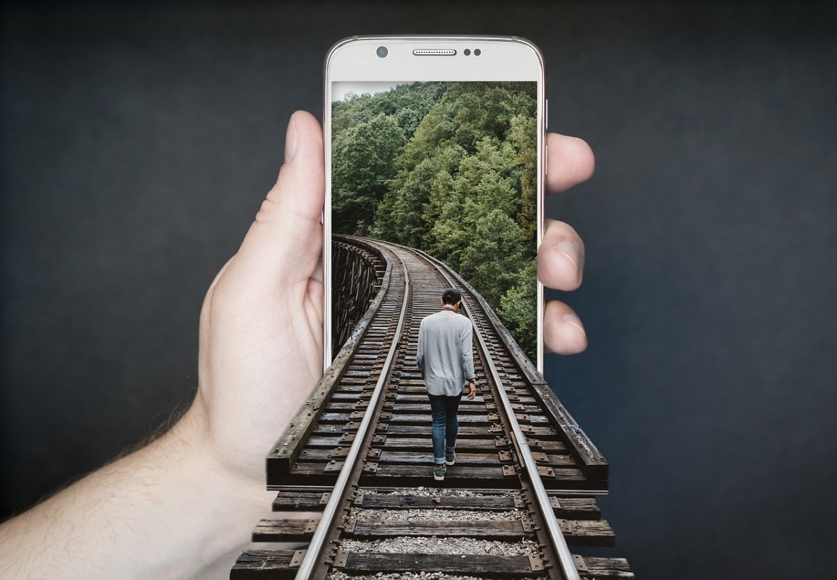 Man reading phone worried