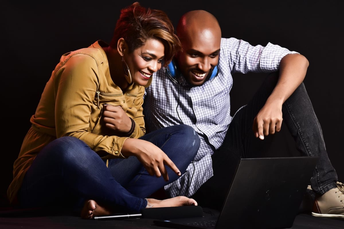 Young african woman laptop home
