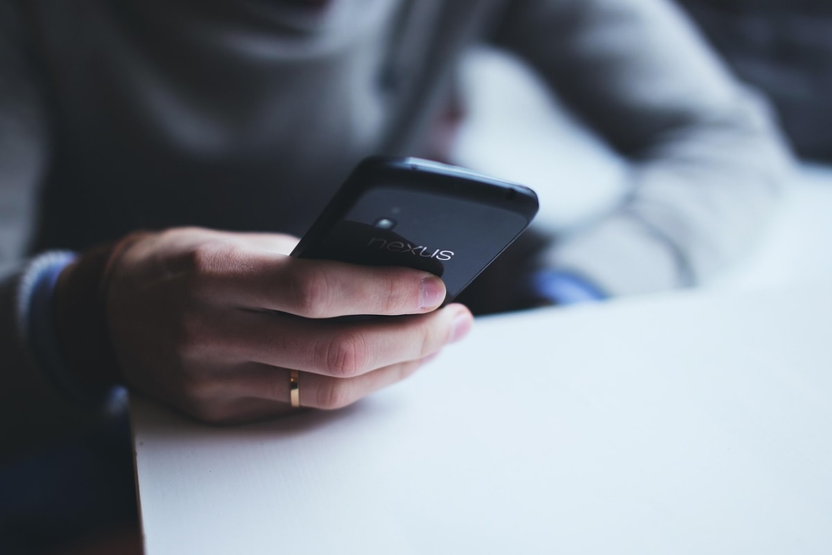 Person checking phone transaction
