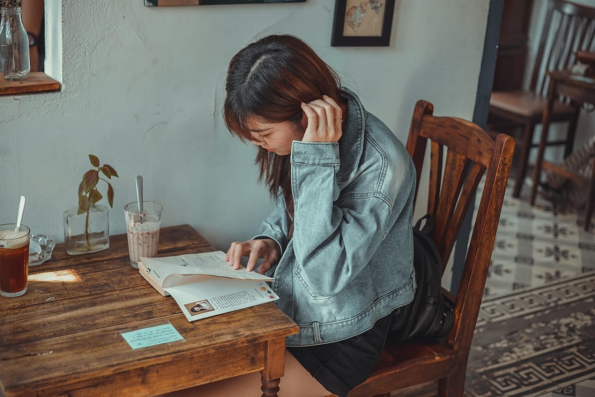 Woman reading contract laptop