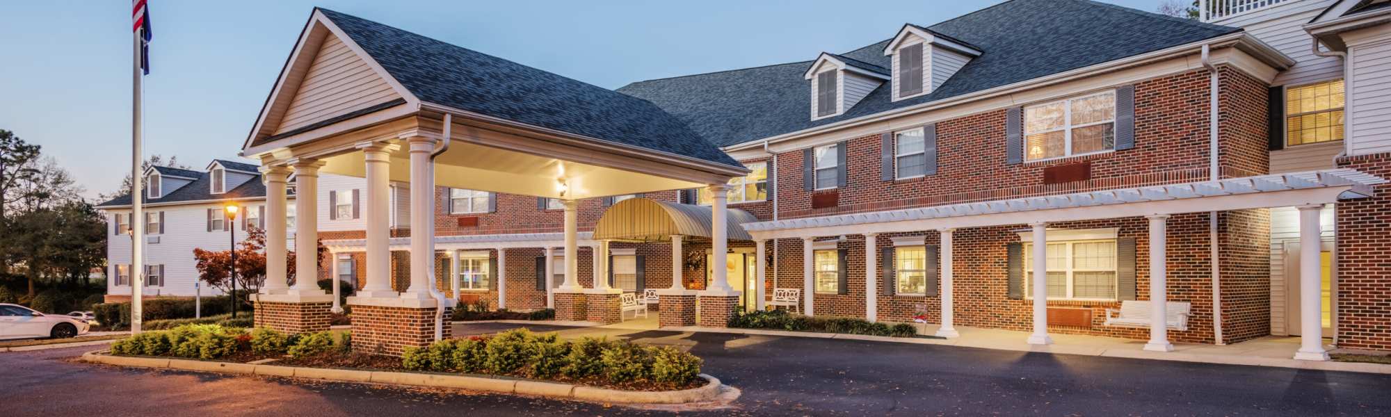 Entrance with columns and awning at Barclay House of Oakleaf Village in Lexington, South Carolina