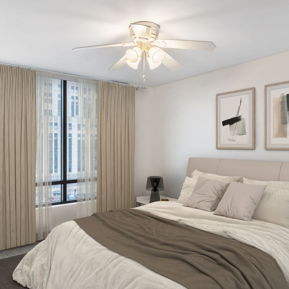 Bedroom with bed, large window, and soft furnishings at Stratford House in Dayton, Ohio