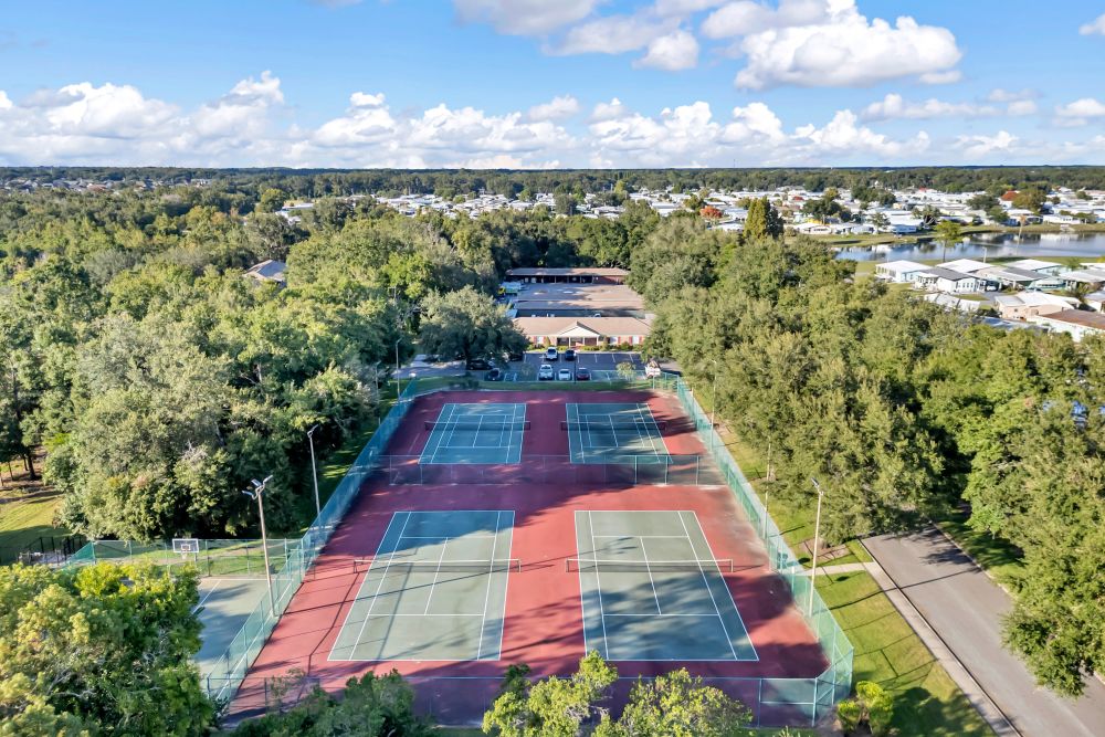 Aerial view of the tennis court at Carlton Arms Of North Lakeland in Lakeland, Florida