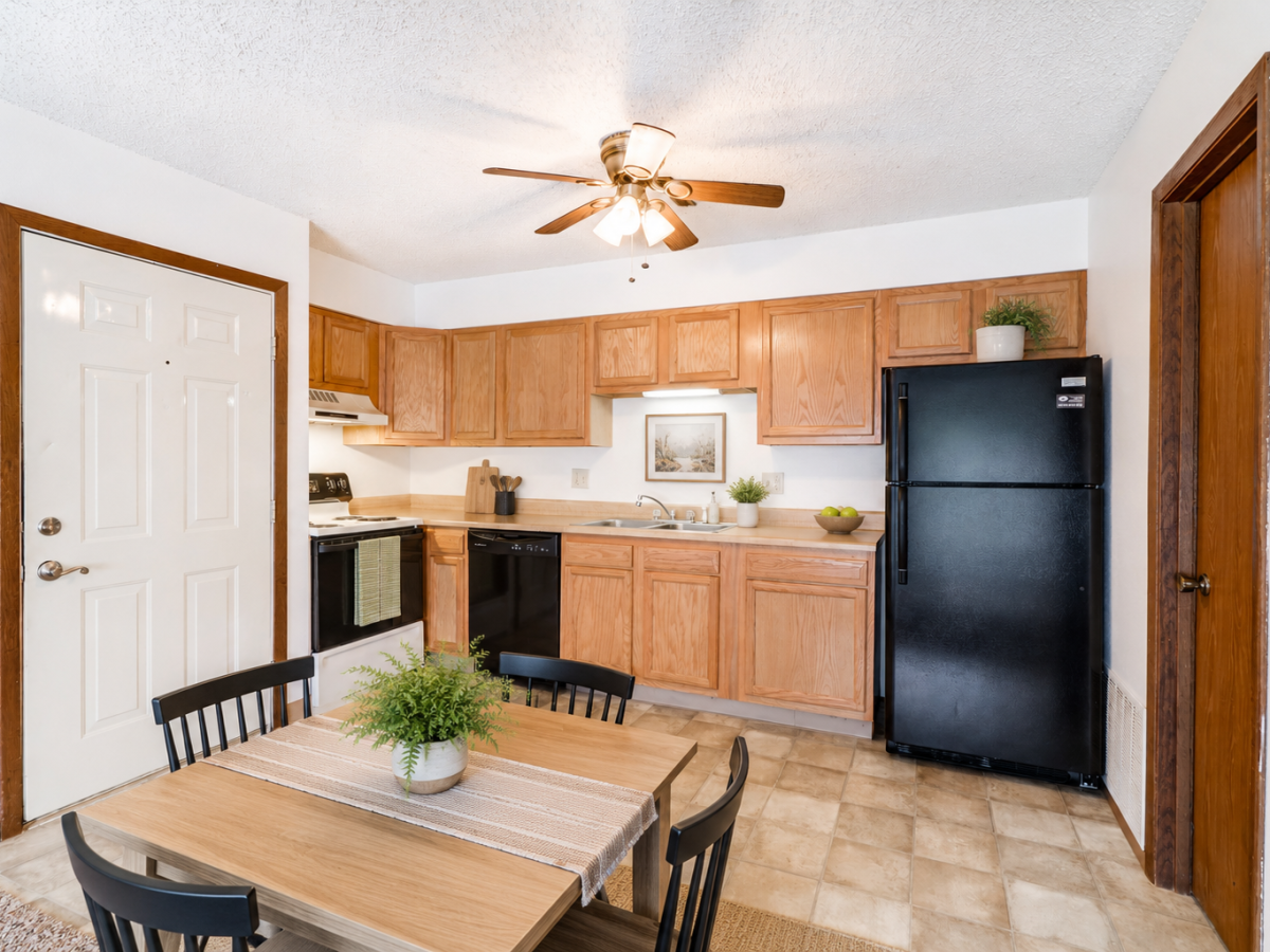 Cozy kitchen with black appliances at South View in Ames, Iowa