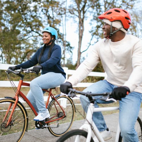 Couple biking on a path near Balcones Trails in Kyle, Texas