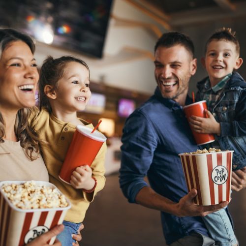 Family enjoying snacks at a movie theater at Balcones Trails in Kyle, Texas