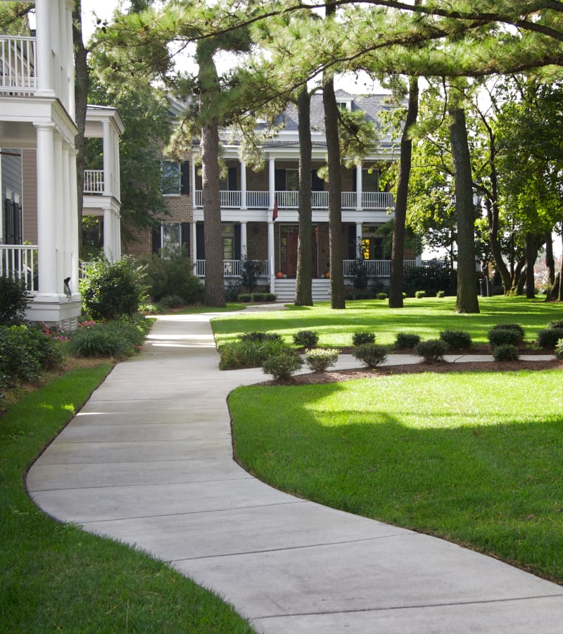 Pathway through the lawn at Village Square Apartments in Norfolk, Virginia