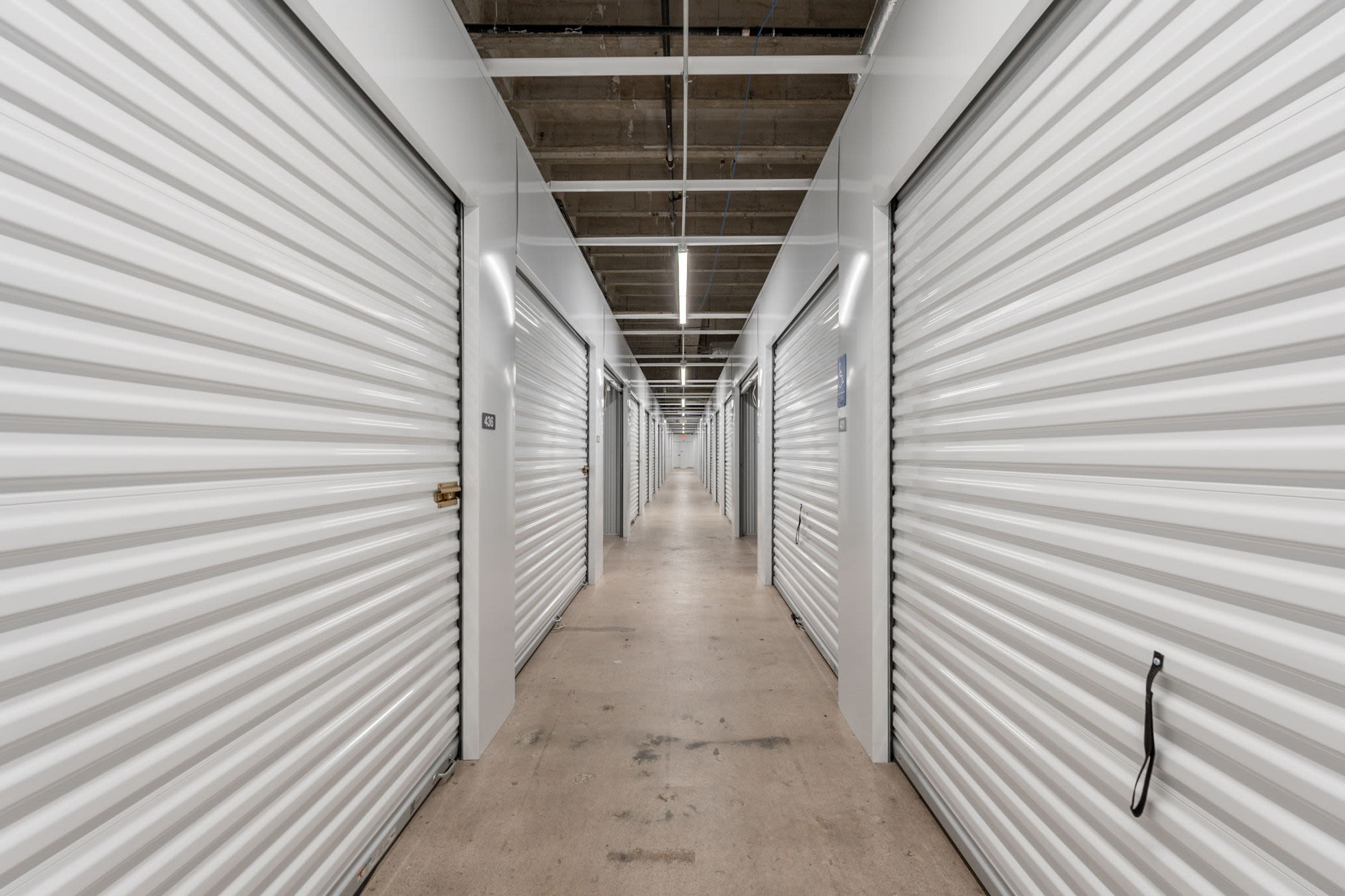 Storage facility hallway with units on both sides at Park Central Self Storage in Phoenix, Arizona