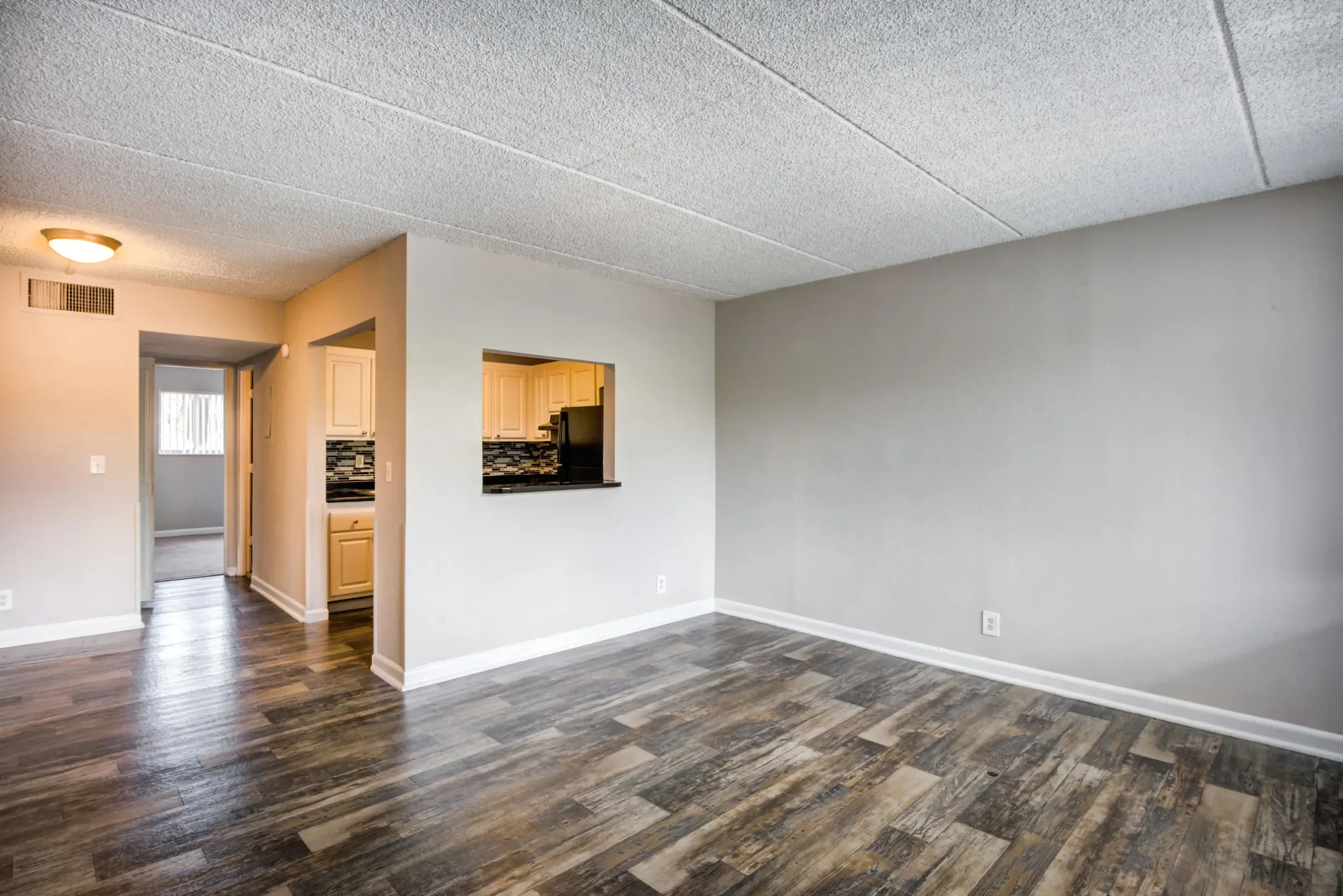 Apartment living room and kitchen at Coronado Springs in Palm Springs, Florida