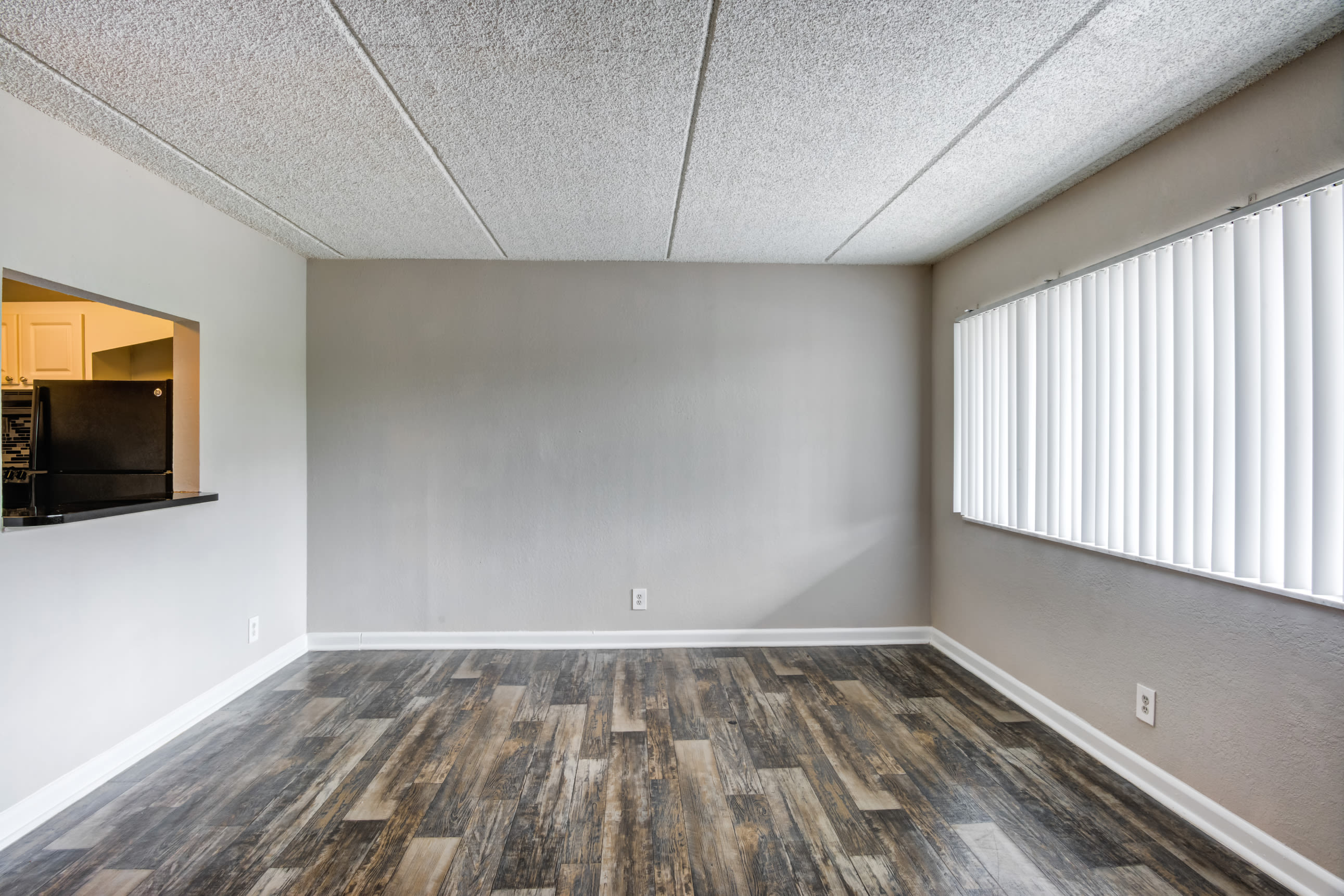 Bright window in an apartment living room at Coronado Springs in Palm Springs, Florida