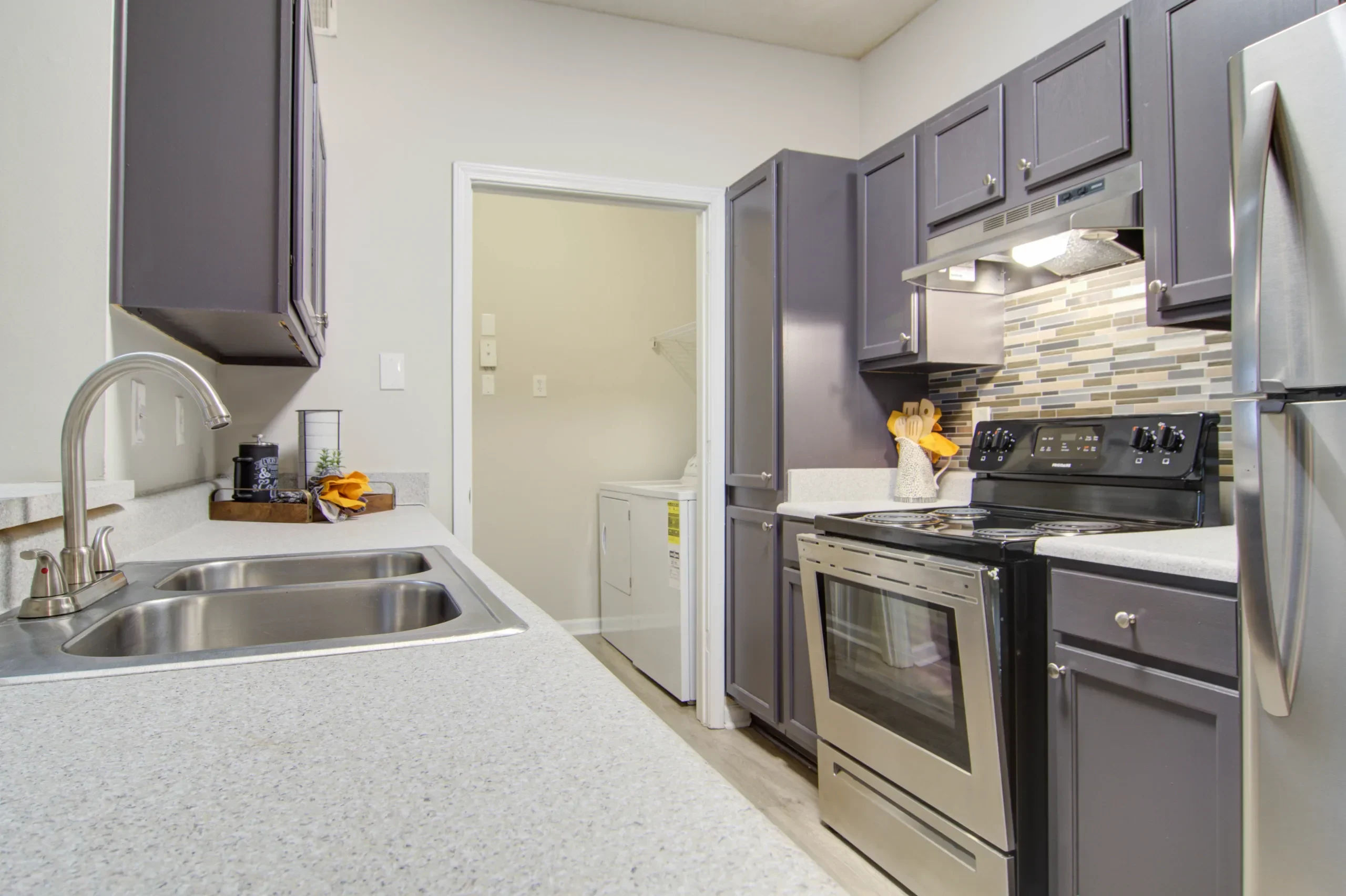 Stainless-steel appliances in an apartment kitchen at Villas at Princeton Lakes in Atlanta, Georgia