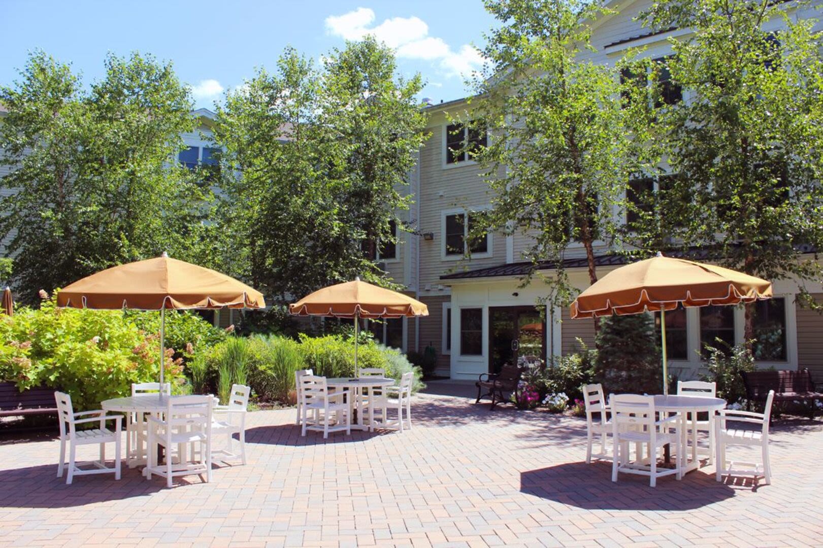 Outdoor patio with pergola at Barstow Village in Hanover, Massachusetts