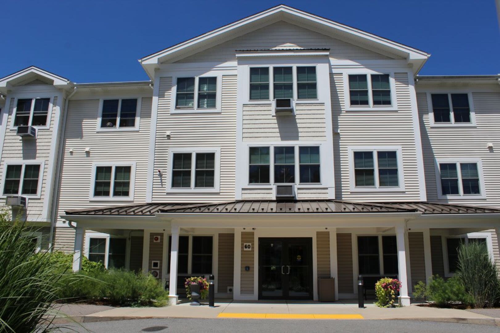 Entrance view of building at Barstow Village in Hanover, Massachusetts