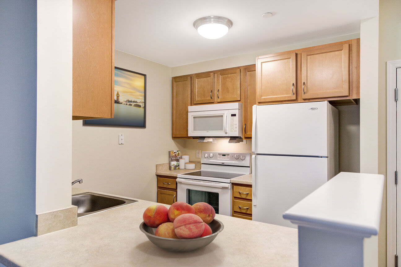 Kitchen with oven, microwave, refrigerator and stove at Barstow Village in Hanover, Massachusetts