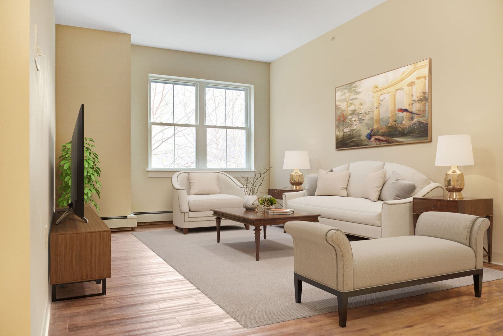 Living room with vinyl plank flooring with carpet, sofas and window at Barstow Village in Hanover, Massachusetts