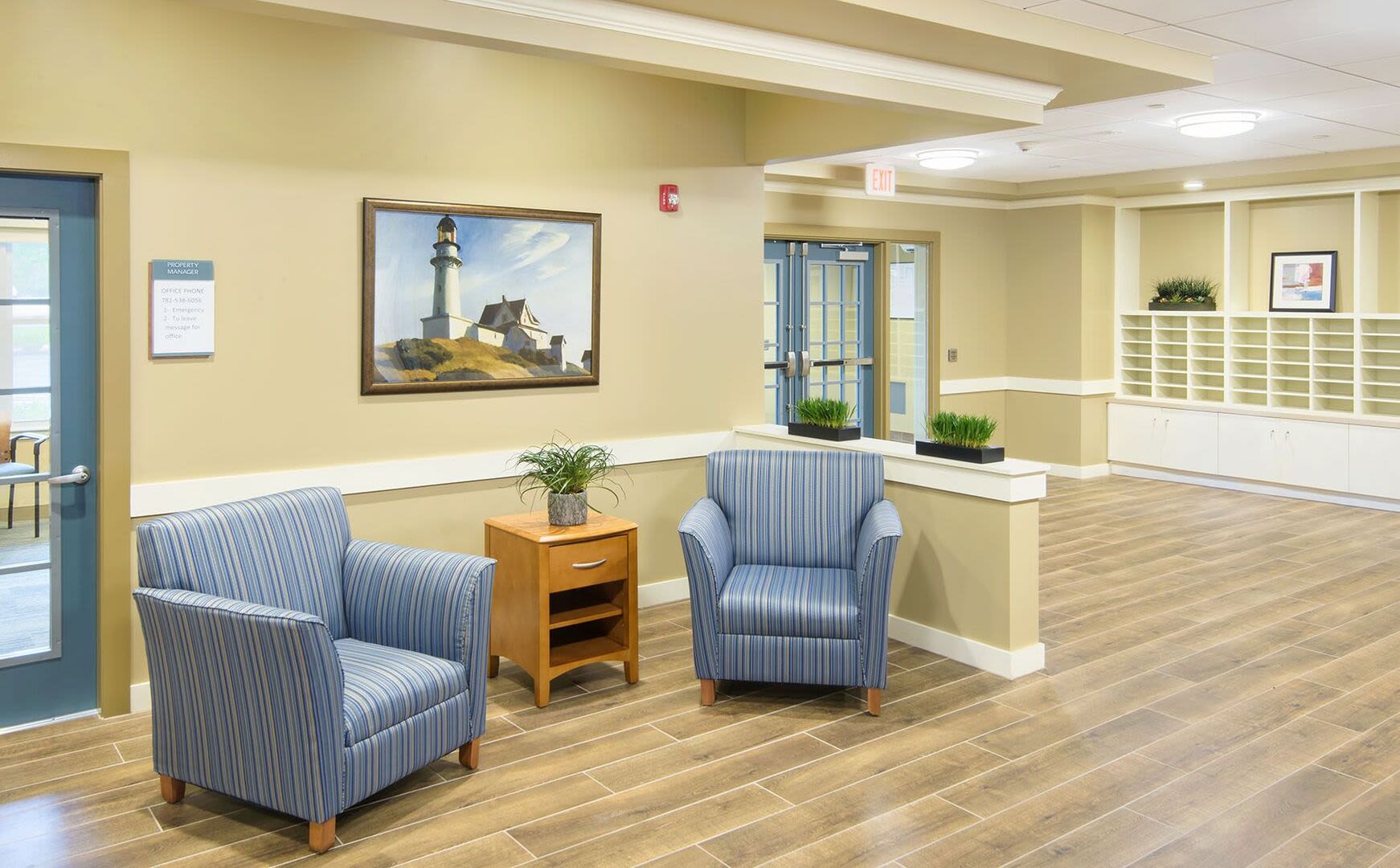 Community seating area with chairs at Bedford Green Apartments in Bedford, Massachusetts
