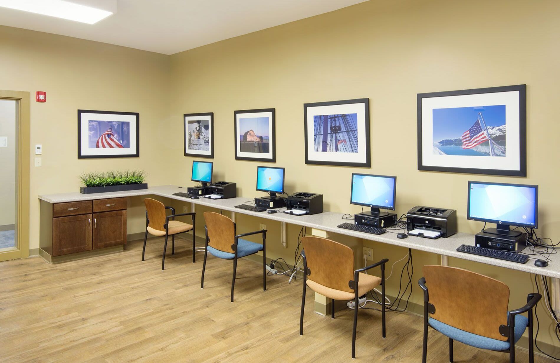 Community office space with computers at Bedford Green Apartments in Bedford, Massachusetts