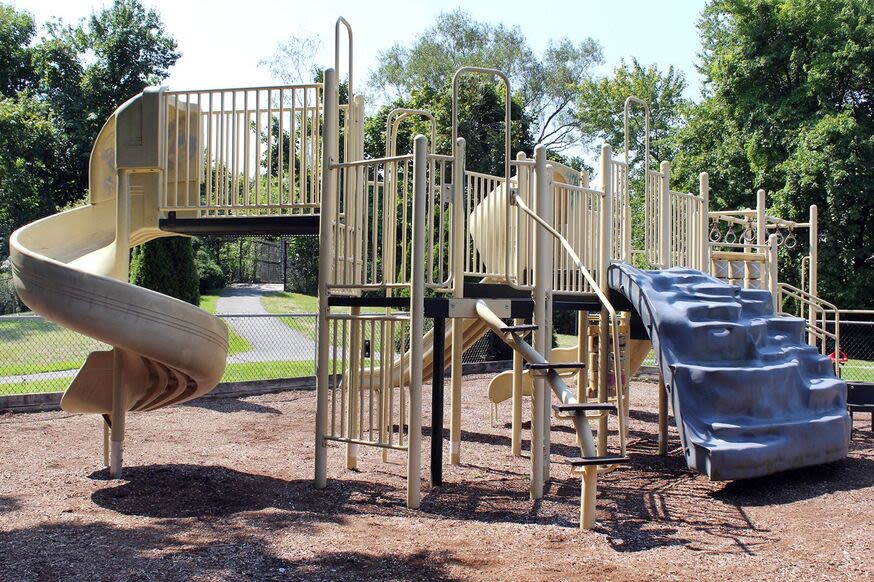 Community playground with slides at Braintree Village in Braintree, Massachusetts