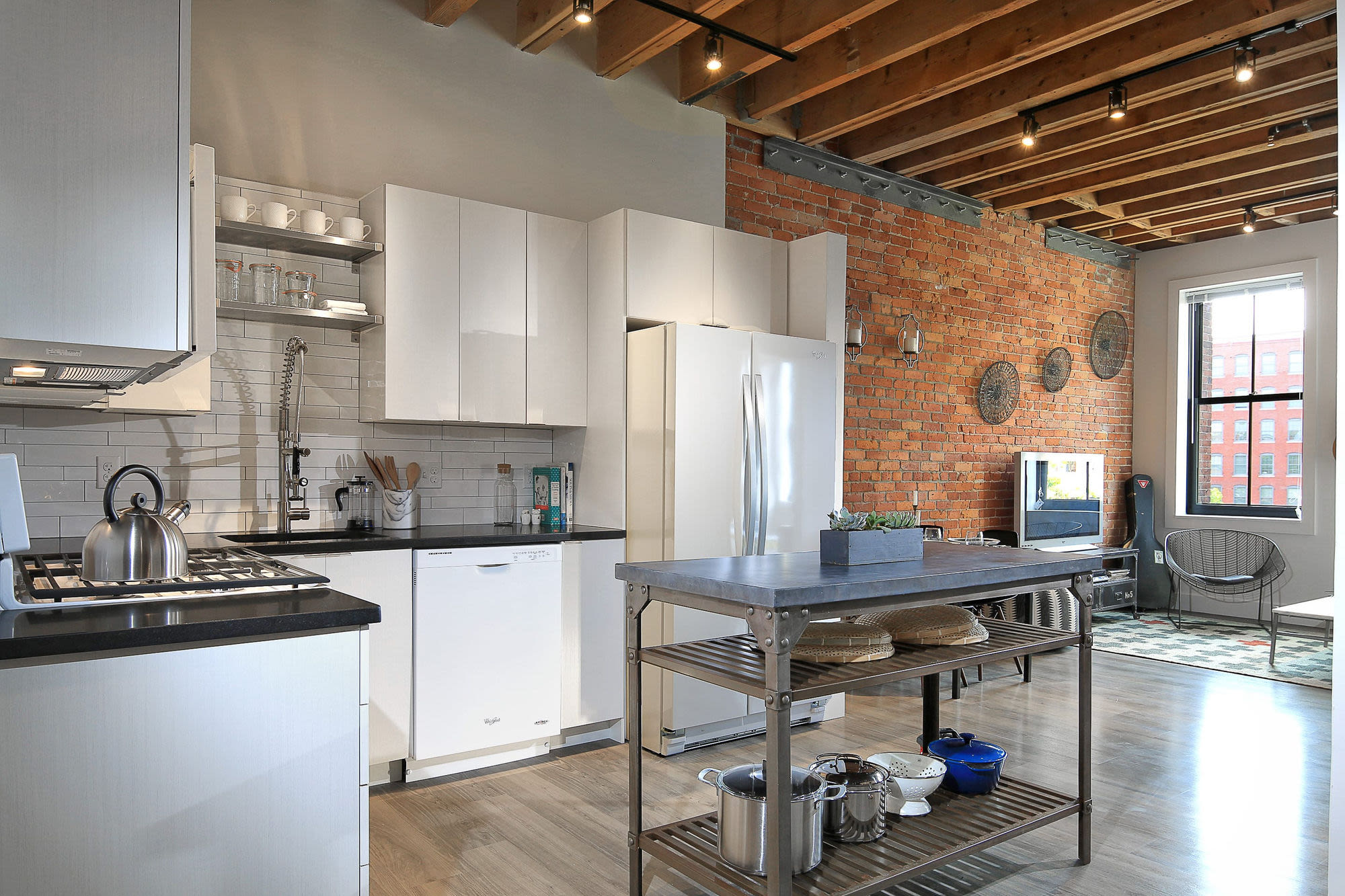 Kitchen with white cabinets at J.M. Lofts in Haverhill, Massachusetts