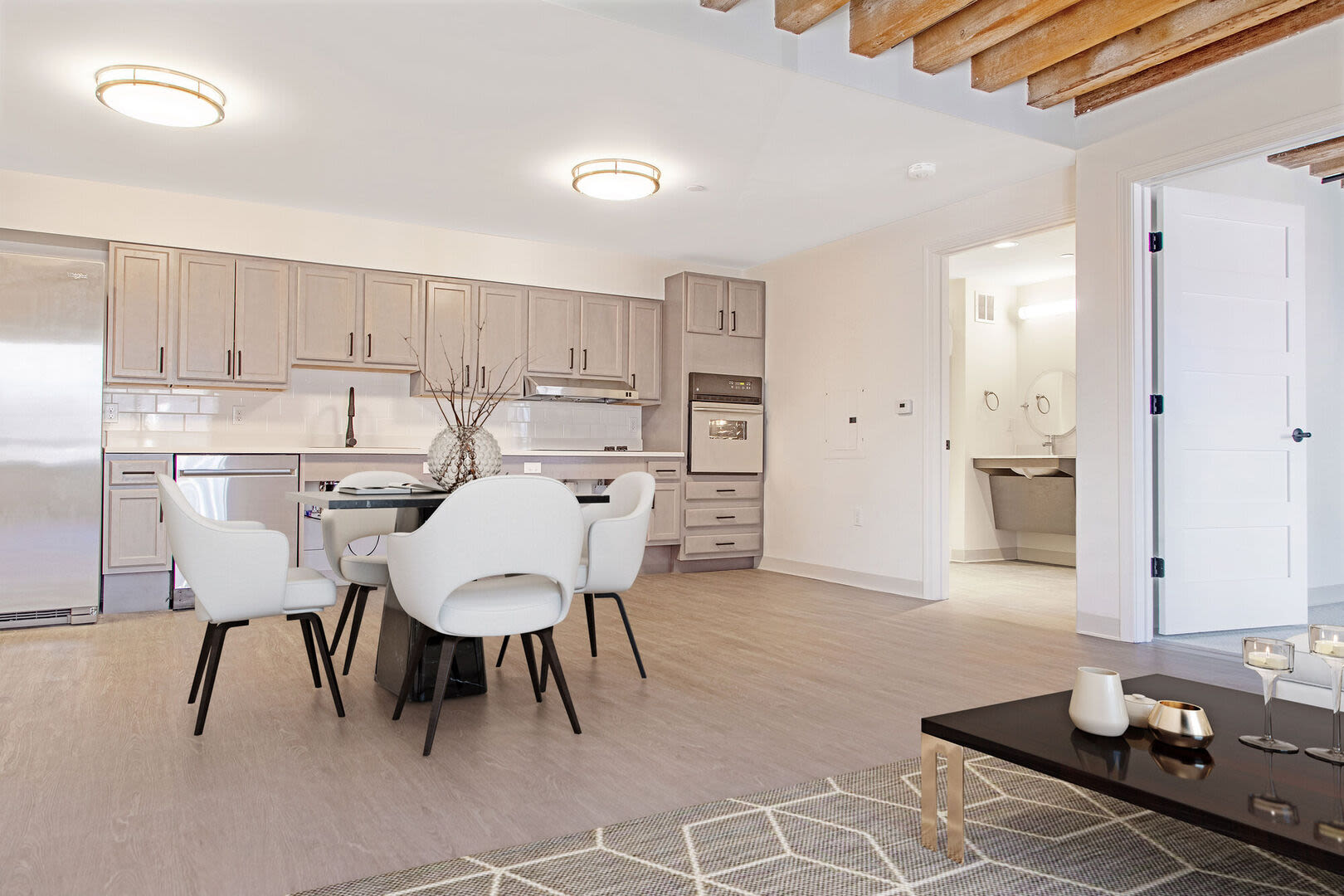 Kitchen and dining with vinyl flooring at Mercantile Wharf in Boston, Massachusetts