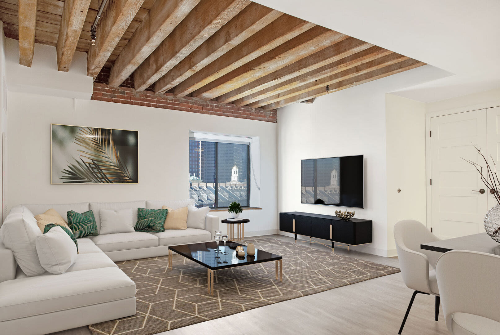 Living room with with a flat-screen television and sofas at Mercantile Wharf in Boston, Massachusetts