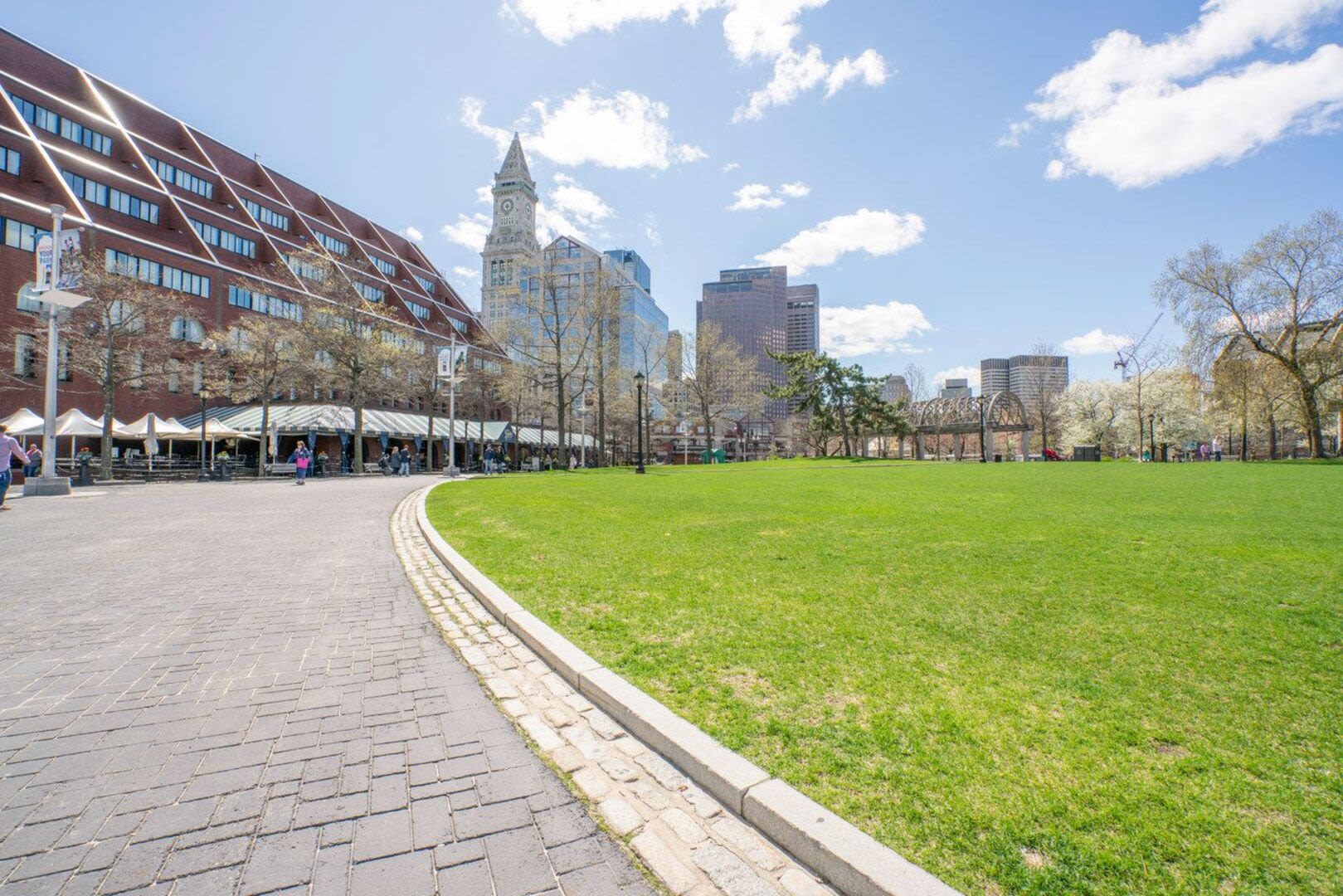 Exterior view of the property with green lawn at Mercantile Wharf in Boston, Massachusetts