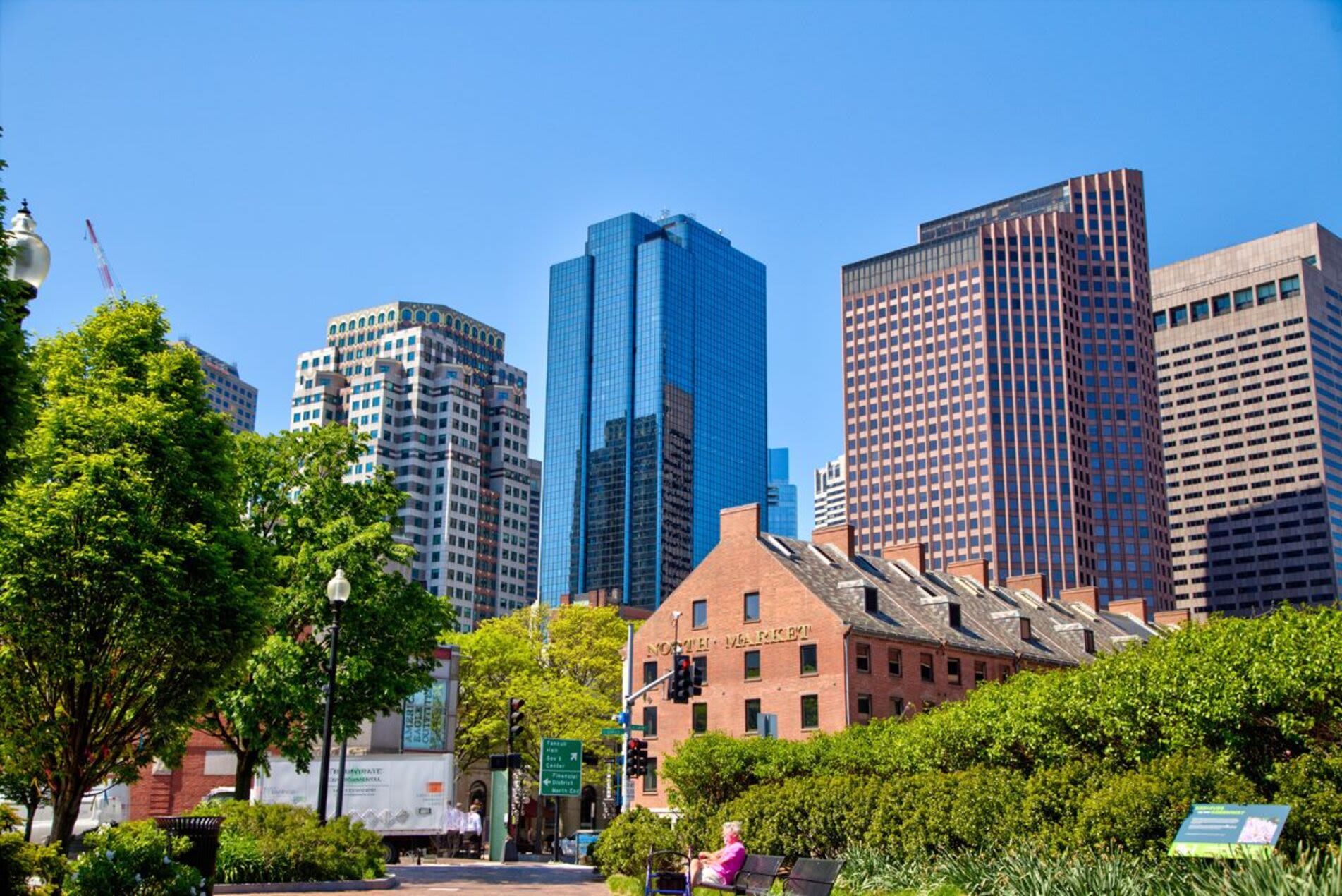 Exterior view of an apartment nestled amidst trees at Mercantile Wharf in Boston, Massachusetts