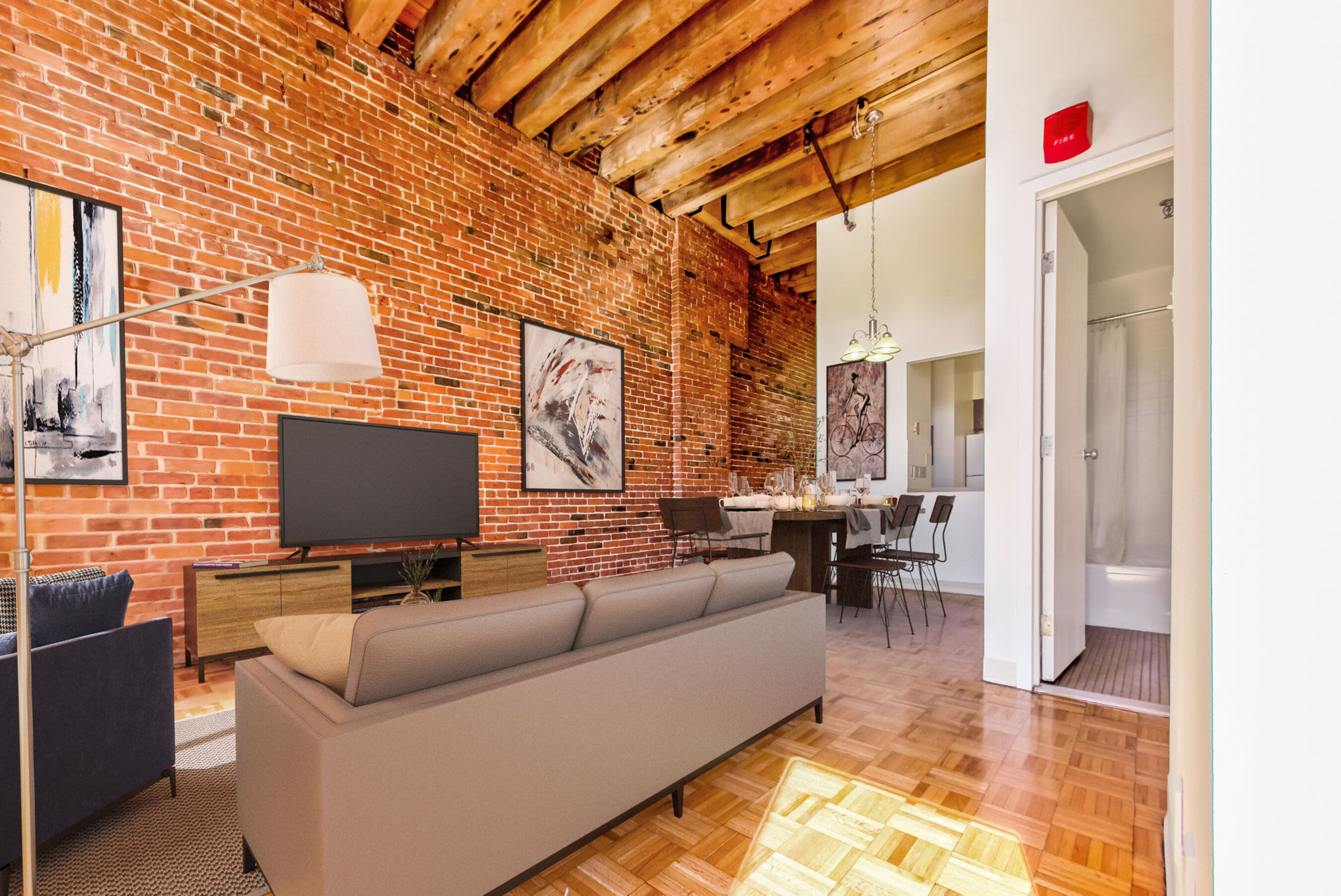 Cozy living room with hard-wood style flooring and hallway at Mercantile Wharf in Boston, Massachusetts
