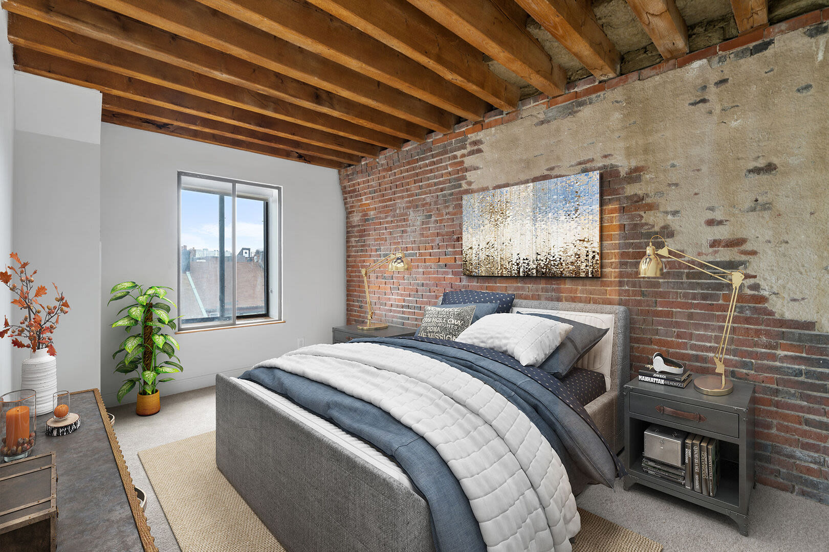 Spacious bedroom with comfortable bed, plush carpet and windows atMercantile Wharf in Boston, Massachusetts