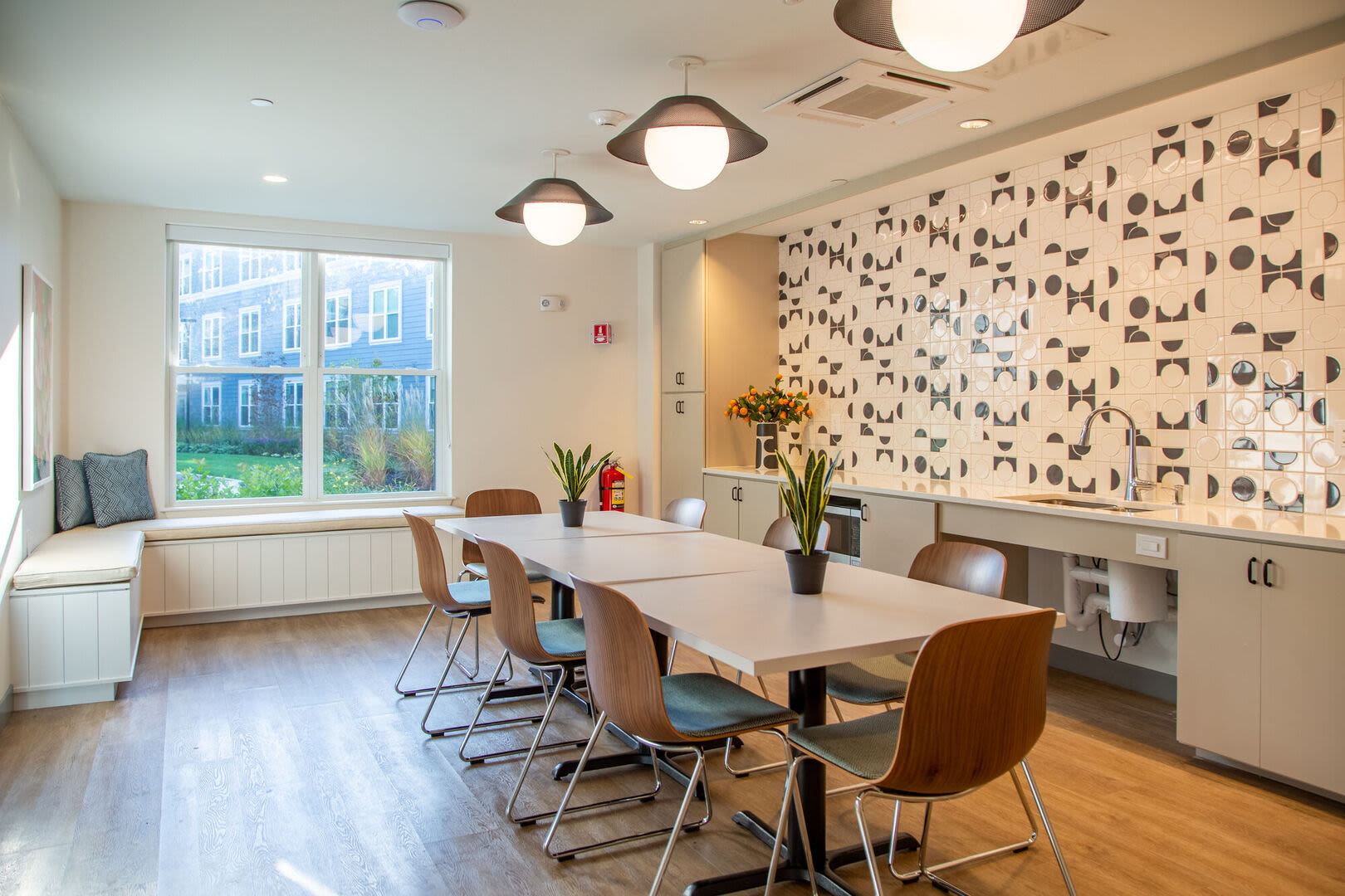 Community kitchen and dining area at Parkway 1208 in West Roxbury, Massachusetts