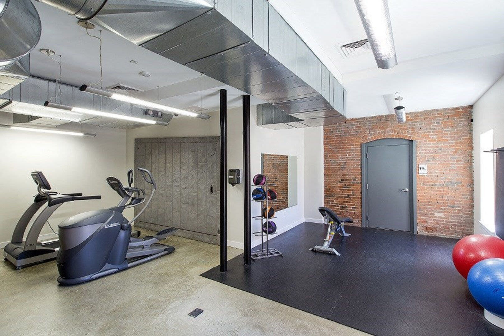 Fitness center with cardio equipment Station Lofts in Brockton, Massachusetts