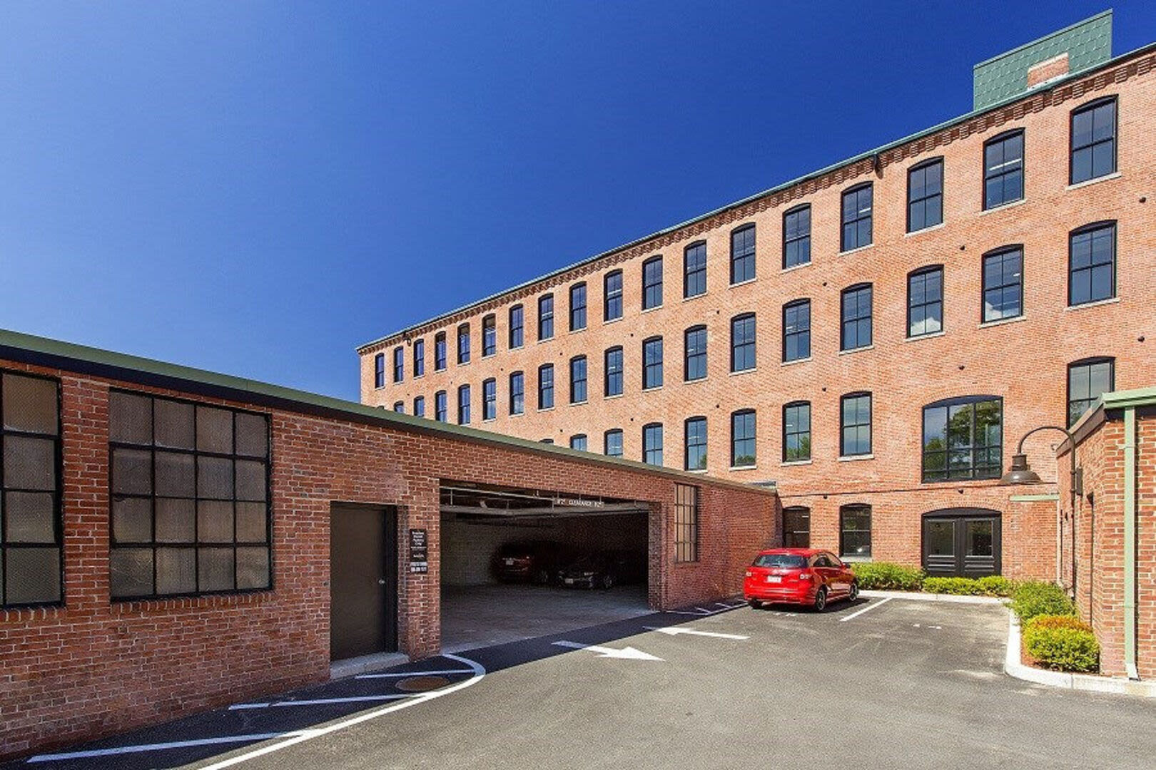 Exterior view of apartment with car parking space at Station Lofts in Brockton, Massachusetts