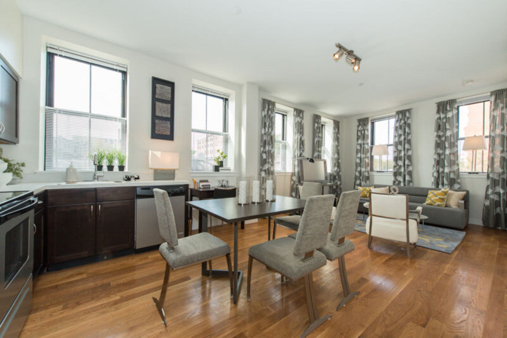 Living room connecting to a kitchen at Station Lofts in Brockton, Massachusetts